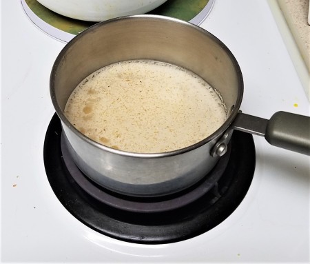 A pan of hot cereal on the stove.