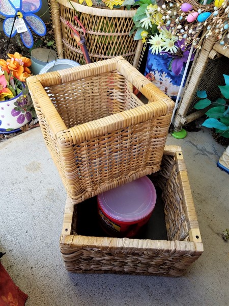 Double Decker Wicker Baskets Floral Display - coffee canister inside the larger basket with the small basket sitting across one corner