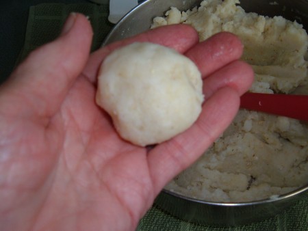 Small pats of cornbread, ready for frying.