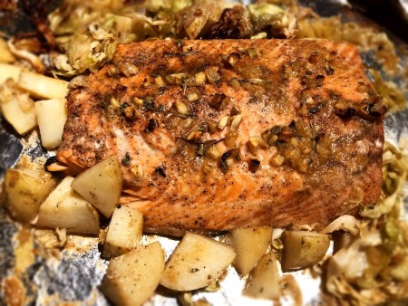 A pan of garlic butter salmon after it has been baked.