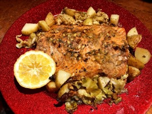 A finished plate of garlic butter salmon.