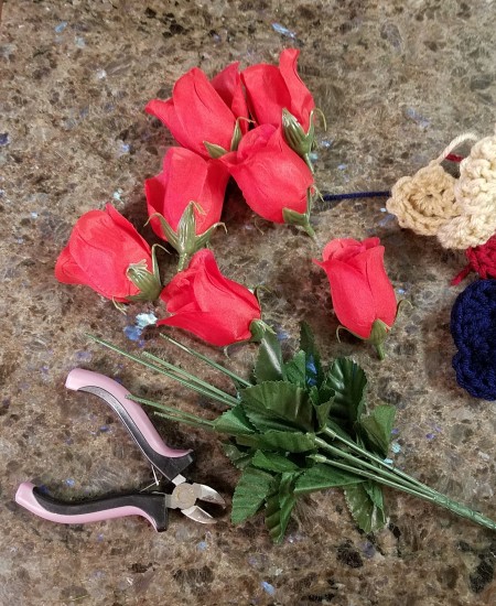 Crocheted Americana Roses - remove the flowers from the stems, leaving the leaves in place