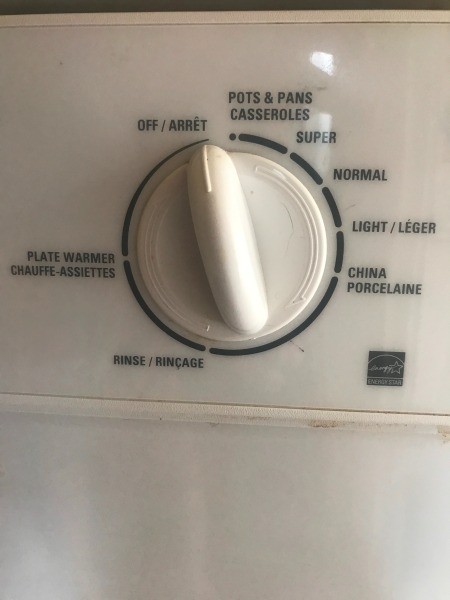 When Is detergent Cup Supposed to Open? - closeup of control knob
