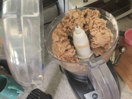 Mixing the pie crust in a food processor.