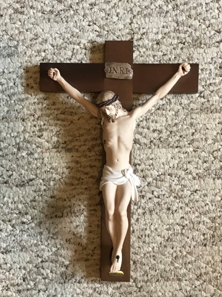 What Is the Value of an Armani Crucifix? - crucifix lying on carpet