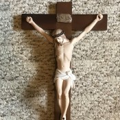 What Is the Value of an Armani Crucifix? - crucifix lying on carpet