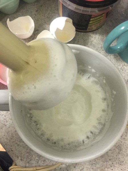 Mixing eggs for strawberry chiffon pie.