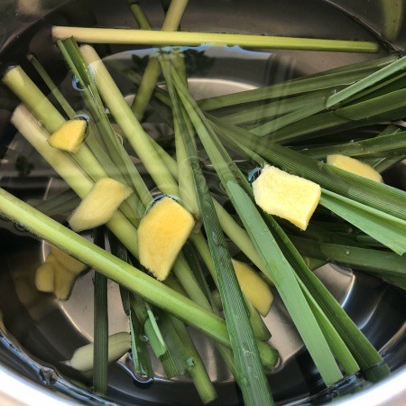 Lemongrass, ginger and water in a Instant Pot.