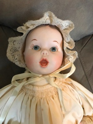Identifying a Porcelain Doll? - doll wearing a christening dress and bonnet, closeup of the face