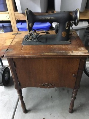 A vintage sewing machine before restoration.