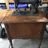 A vintage sewing machine before restoration.