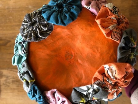 Yo Yo Covered Papier-mâché Pumpkins - adding last round to the bottom of the taller pumpkin