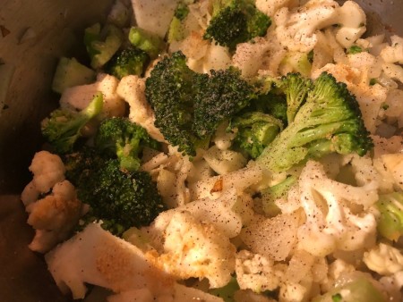 Cauliflower and broccoli in a soup pan.