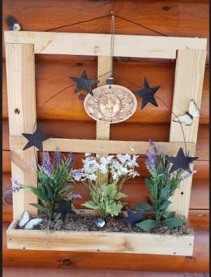 Decorative Junk Wood Window Frame - scarp shipping wood packaging made into a window with a flowerbox decoration