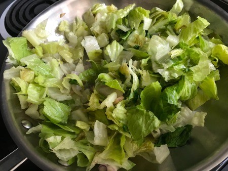 A pan of chopped romaine lettuce.