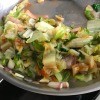 A pan of sauteed romaine lettuce.