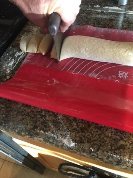 Cutting the noodles from the dough.