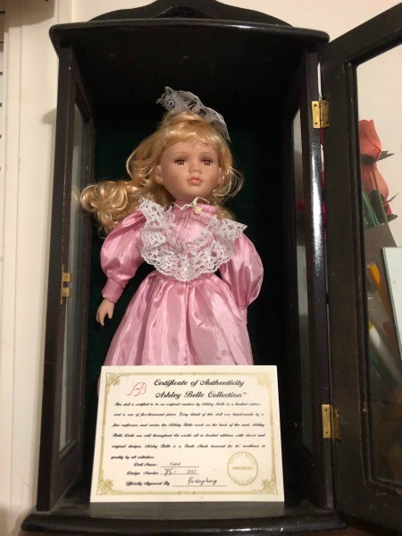 Value of an Ashley Belle Doll? - doll wearing a pink dress in a black wooden case