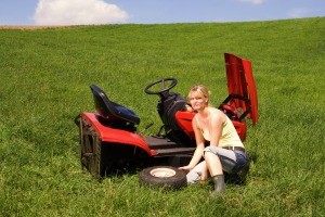A riding lawnmower in need of repair.