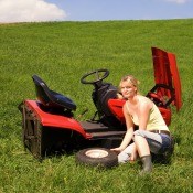 A riding lawnmower in need of repair.