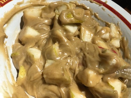 Mixing the pears into the cake batter.