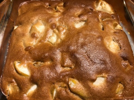 The baked cake in a pan.