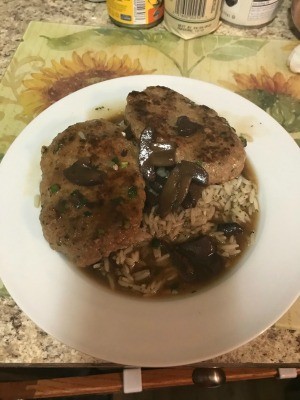 A plate of lamb patties over rice.