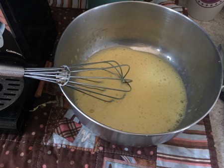 Mixing eggs in a bowl.