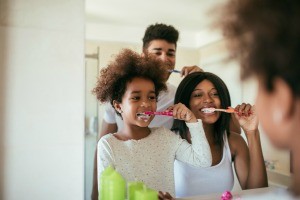 A family brushing their teeth.