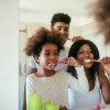 A family brushing their teeth.