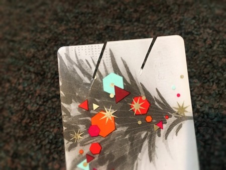 DIY Earbuds Holder - two slits in one end of the gift card, cut at an angle