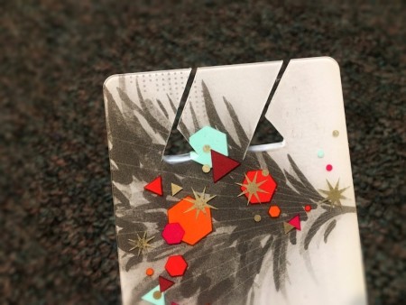 DIY Earbuds Holder - triangle shapes cut at the base of the slits