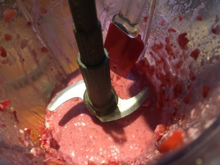 Mixing the strawberry mousse ingredients together.