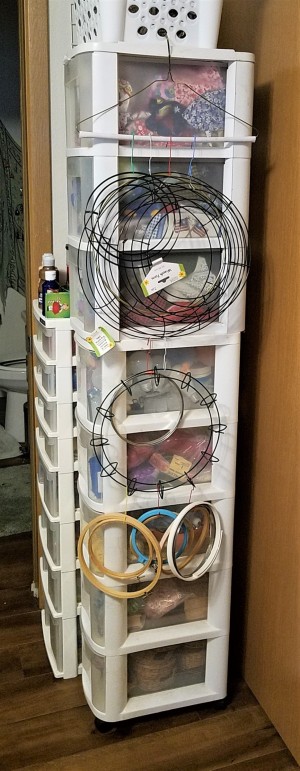 Hanger, Clips, and Rings for Craft Storage - wreath rings and embroidery hoops hanging from a hanger