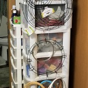 Hanger, Clips, and Rings for Craft Storage - wreath rings and embroidery hoops hanging from a hanger