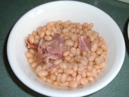 Ham and beans in a bowl.