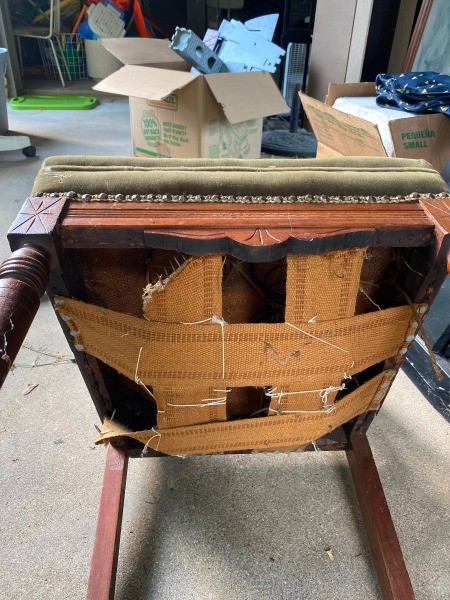 The underside of an antique chair.