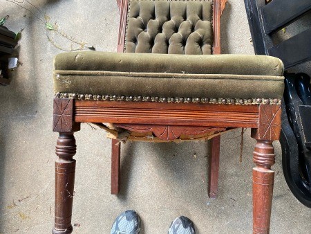 The front of an antique chair.