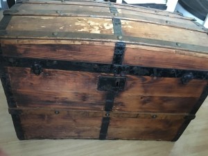 The front of an old wooden trunk.
