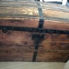 The front of an old wooden trunk.