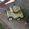 An old yellow lawnmower.