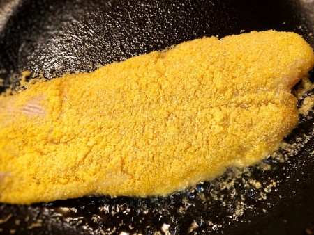 Cooking the filet in a frying pan.