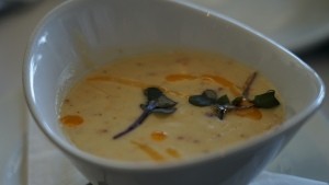 An elegant bowl of soup served at a wedding.