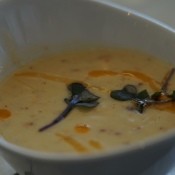 An elegant bowl of soup served at a wedding.