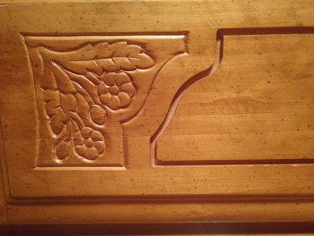 A carving on a Bassett dresser.