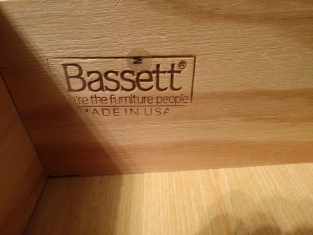 A Bassett furniture marking inside a dresser.