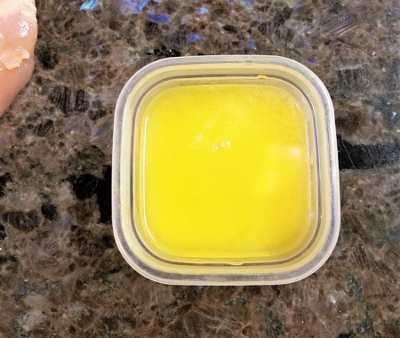 A container with melted butter.