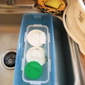 Soaking dishes in bleach water.