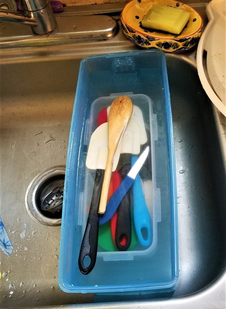 Soaking dishes in bleach water.