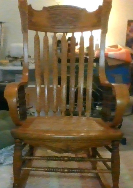 A wooden rocking chair.